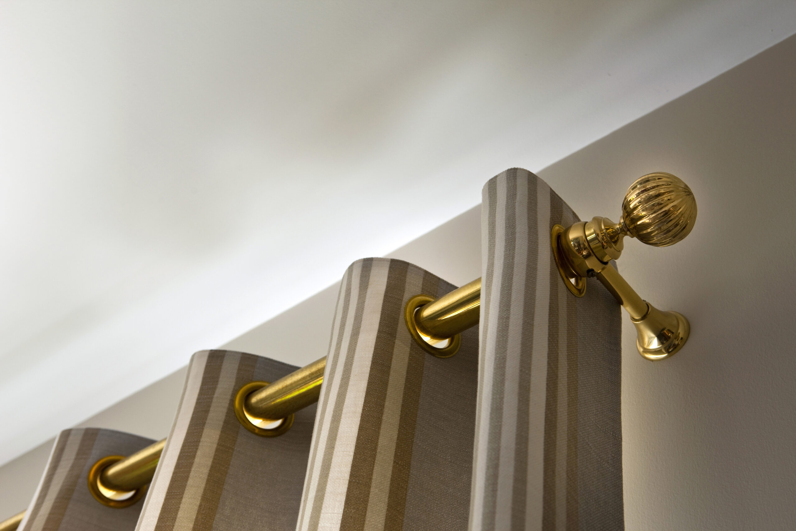 Brass curtain rod in a house