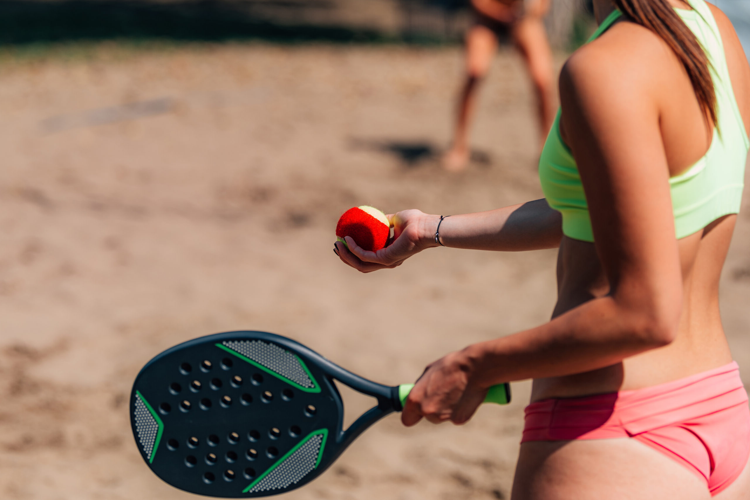 Female Team Playing Beach Tennis