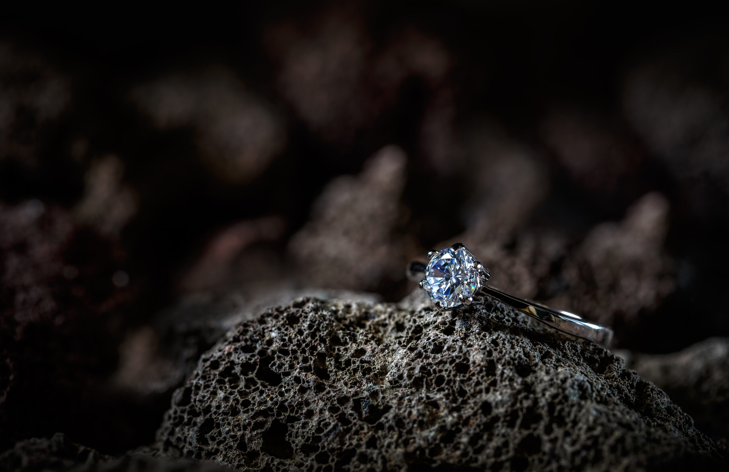 Ring decorated with crystal lying on rock